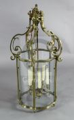 A Victorian brass hall lantern, with bow front glazed panels, H.2ft 11in.