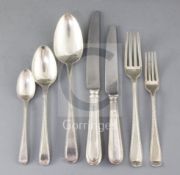 A part canteen of George III Old English beaded pattern flatware for twelve by Ely, Fearn & Chawner,