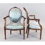 A set of eight Hepplewhite design mahogany elbow chairs, with blue silk fabric upholstery and carved