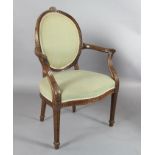 A set of eight Hepplewhite design mahogany elbow chairs, with blue silk fabric upholstery and carved