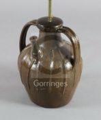 A French medieval brown spouted jar, with two lug handles, 13.5in.