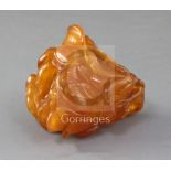 A Chinese amber 'magnolia' brushwasher, Qing dynasty, finely carved as a magnolia flower, buds and