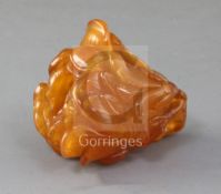 A Chinese amber 'magnolia' brushwasher, Qing dynasty, finely carved as a magnolia flower, buds and