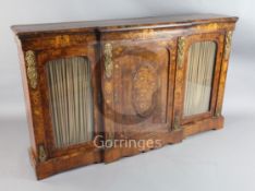 A 19th century French walnut and marquetry breakfront side cabinet, with central panelled door