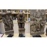 Three Middle Eastern wood carvings, on stand tallest 60cm