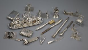 Assorted silver etc. including Dutch white metal figures, a miniature tea set & tray, cigar cutter ,