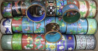 A collection of cloisonne napkin rings, including a set of six and three pairs (total 31)