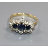 An 18ct gold, sapphire and diamond fifteen-stone cluster ring, claw set, size Q.