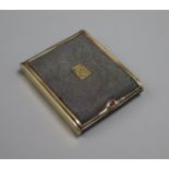 A shagreen and gilt metal cigarette case by Cartier, with gold monogram and cabochon ruby to thumb-