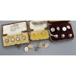 A pair of engraved yellow metal oval cufflinks, a set of three dress studs and three sets of dress