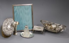 A small collection of silver and silver-mounted items, including a pair of embossed silver-backed