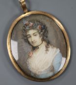 A 19th century Continental oil on ivory miniature of a lady with flower in her hair 4.5 x 4cm,