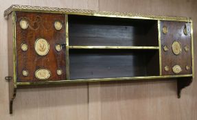 A 19th century brass-bound inlaid mahogany wall-hanging bookshelf, fitted open shelves flanked by