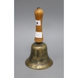 A hand bell marked A.R.P. length 25cm