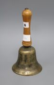 A hand bell marked A.R.P. length 25cm