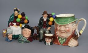 Two Royal Doulton figures, 'The Old Balloon Seller' and 'Balloon Man', a Beswick Toby Weller jug and