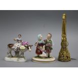 A gilt metal posy holder and a pair of German figures