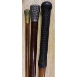 An Indian silver topped cane and two other canes
