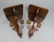 A pair of 19th century brass-mounted faux rosewood wall brackets