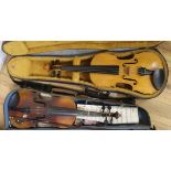 A cased violin and a three quarter size violin