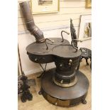 A Dutch barge wood turning stove W.68cm