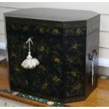 A Japanese lacquered small chest with canted corners, all-over decorated with gilt flowers and