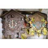 Two cuckoo clocks and parts