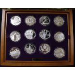 The Royal Mint Queen Elizabeth II Golden Jubilee Collection - 19 sterling silver proof five dollars,