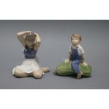 A Royal Copenhagen model of a seated ballerina, number 4648, and another of a boy sitting on a