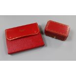 Two Cartier gilt tooled red leather jewellery boxes.