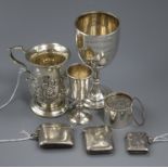 Three silver vestas, a modern cylindrical box, a Russian silver kiddush cup, a mug and a trophy cup