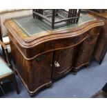 A 19th century Continental mahogany writing desk of serpentine form W.109cm