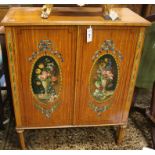 A Sheraton style two door satinwood cabinet W.76cm