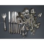 A silver spoon and pusher, a collection of small silver flatware, six silver-handled butter knives