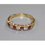 An 18ct yellow gold, ruby and diamond seven-stone ring, collet-set size P/Q.