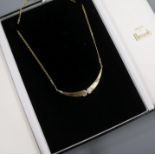 An 18ct three-colour gold pendant necklace incorporating two diamond-set crescents, approx. 40cm.