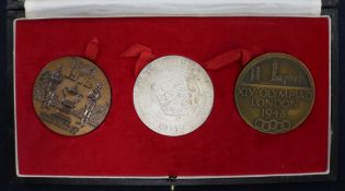 A 1948 Olympics bronze medallion and two 1972 commemorative FA Cup medallions, one in silver, the