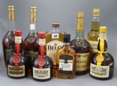 Nine assorted bottles of spirits including whisky, cognac and Grand Marnier.