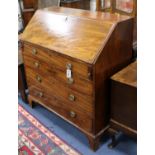 A Regency mahogany bureau, fitted fall flap over four graduated long drawers W.99cm