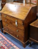 A Regency mahogany bureau, fitted fall flap over four graduated long drawers W.99cm