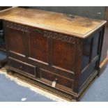 A mid 18th century panelled oak mule chest, monogrammed E.H. W.109cm