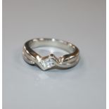 A platinum and solitaire princess cut diamond ring, size I/J.