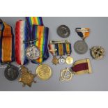 A collection of family medals and other items, including a WWI trio to Pte J M Easton, London Regt.,