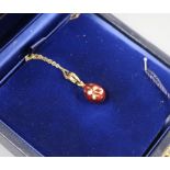 A cased Victor Mayer for Faberge 18ct gold, red enamel and diamond set egg pendant, on 18ct gold