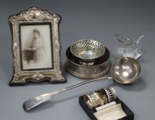 A modern silver coaster, a cased pair of silver napkin rings and other silver and plated items