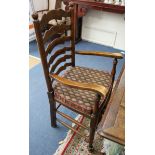 A set of six early 19th century ash and elm rush seated ladderback chairs