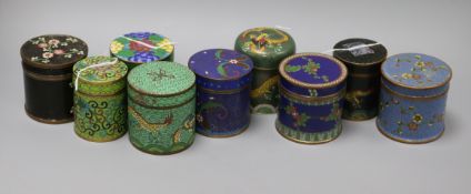 A collection of cloisonne cylindrical boxes and covers, including a blue ground example with bands