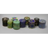 A collection of cloisonne cylindrical boxes and covers, including a blue ground example with bands