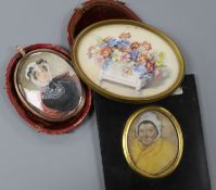 A Victorian oil on ivory miniature of a lady wearing a bonnet, in leather case and two other