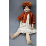 A bisque headed doll by "Max Handwerk" Germany length 70cm